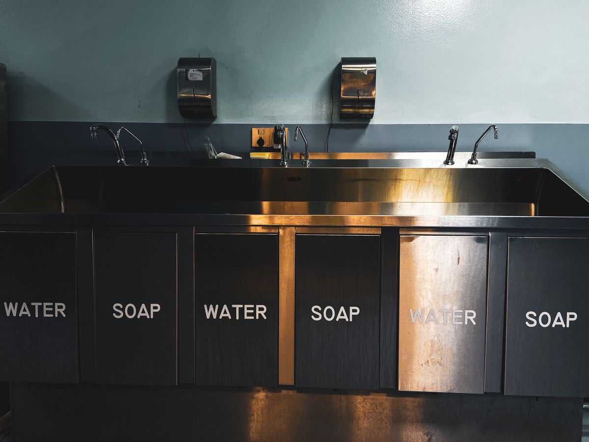 Stainless steel sinks and plumbing in a commercial kitchen